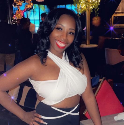 Client Photo Submission for Testimonial. Female, ABiAN (Black), USA 20-30 years of age, broad smile, bare arms, shoulders, and midriff.